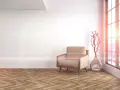 Jasne, oto opis:

Przytulny fotel stoi obok nowoczesnej wazy z gałęzią. Podłoga w jodełkę dodaje elegancji wnętrzu.