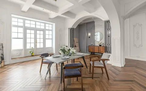 Elegancki salon z jadalnią, łuk wykończony sztukaterią, drewniana podłoga w jodełkę.