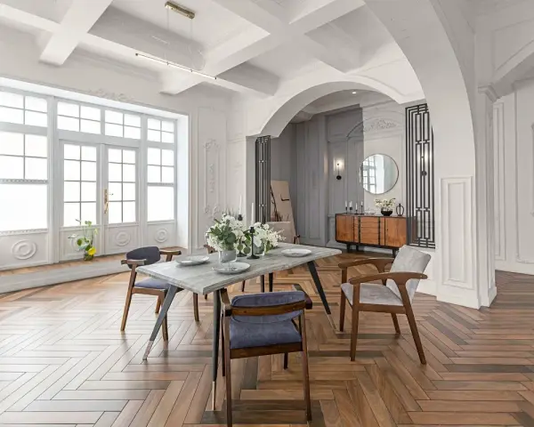 Elegancki salon z jadalnią, łuk wykończony sztukaterią, drewniana podłoga w jodełkę.