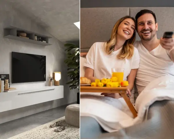 Nowoczesna ściana TV w sypialni z minimalistyczną szafką i parą cieszącą się porankiem w łóżku z tacą śniadaniową.