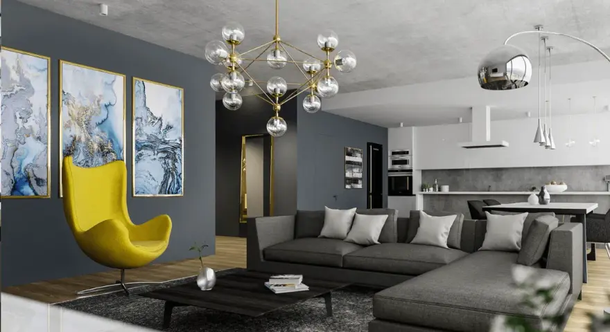 Nowoczesny salon z szarą kanapą i żółtym fotelem. Obrazy i designerska lampa dodają charakteru, pokazując, jak rozjaśnić pokój dodatkami.
